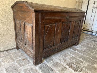 A molded and carved wooden chest, early 17th...