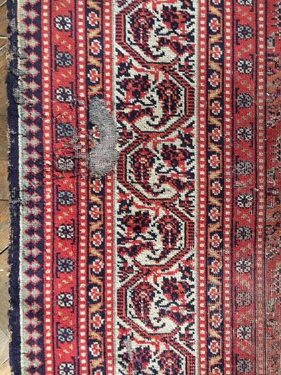 Woolen carpet with red background decorated...