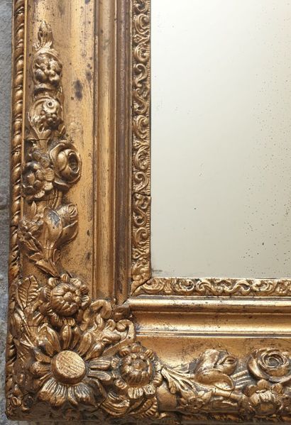 Glass in molded wood, carved and gilded,...