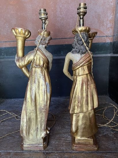 Pair of figures mounted in a carved and gilded...