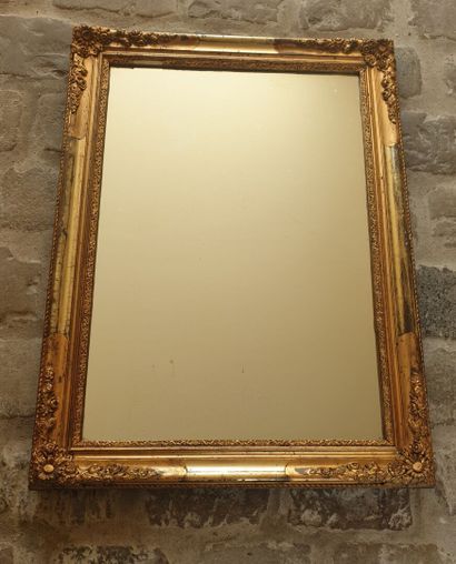 Glass in molded wood, carved and gilded,...