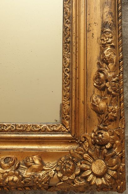 Glass in molded wood, carved and gilded,...