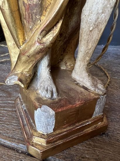 Pair of figures mounted in a carved and gilded...