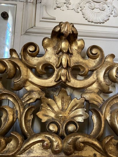 Carved and gilded wood mirror, the openwork...
