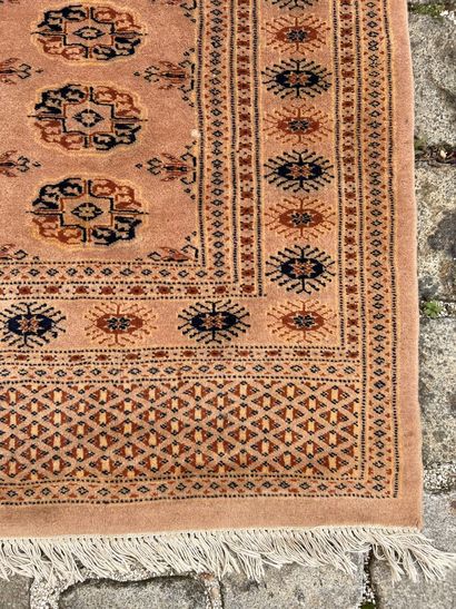 Two woolen carpets 

With geometrical decoration...
