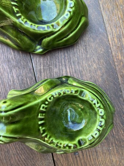 Two ashtrays in green glazed earthenware...