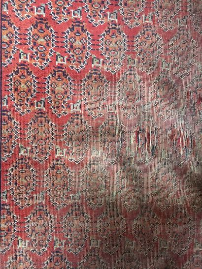 Woolen carpet with red background decorated...
