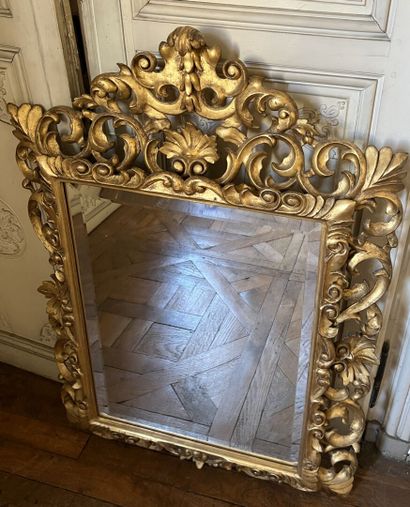 Carved and gilded wood mirror, the openwork...