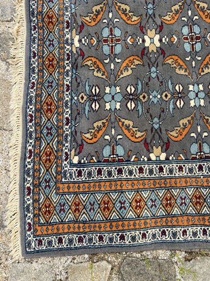 Two woolen carpets 

With geometrical decoration...