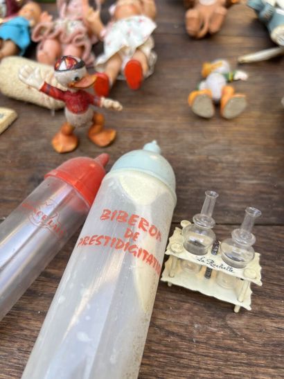 Large lot of dolls, comic book figures, wind-up...