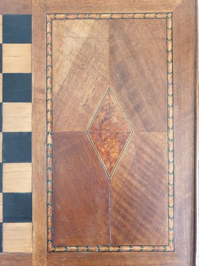 Louis XV period game table in fruit wood.

It...