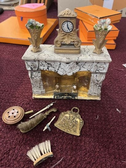 Miniature porcelain mantelpiece forming a...