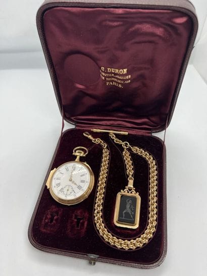 Gold pocket watch with its chain, decorated...