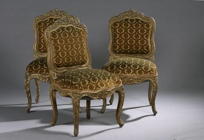 Suite of three chairs in molded wood, carved...