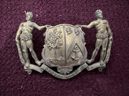 Gilded bronze plate

Decorated with a coat...
