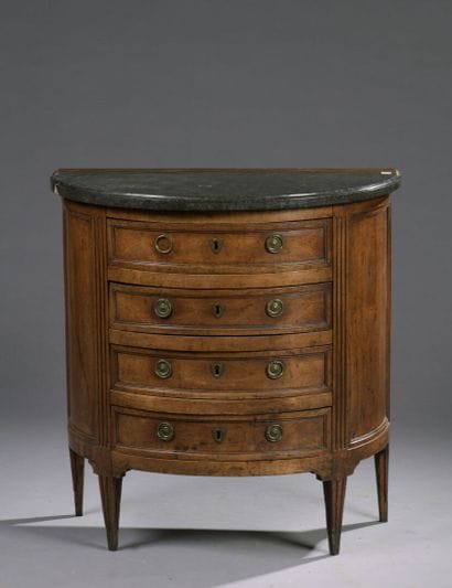 Half moon walnut chest of drawers from the...