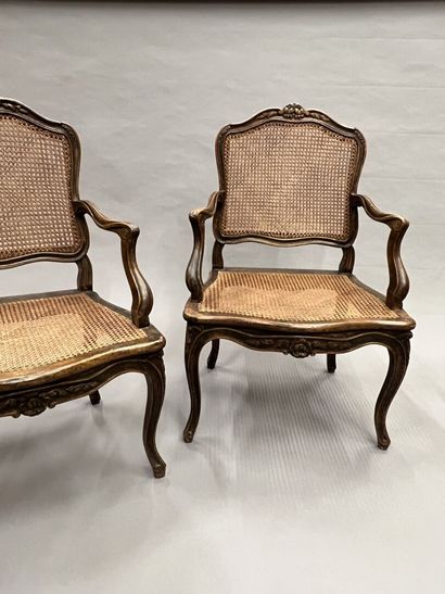 Pair of caned armchairs in molded and carved...