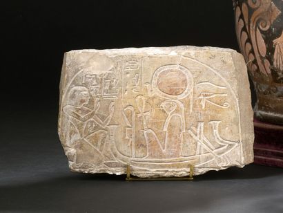 Upper part of a stele engraved in bas-relief...