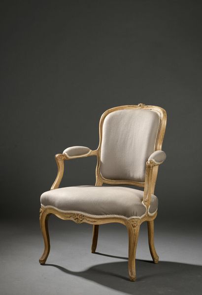 Molded and carved wood armchair stamped A....