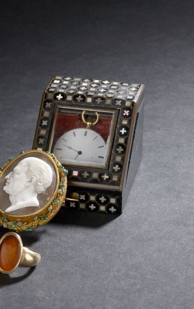 Gold watch circa 1850
On the back a coat...