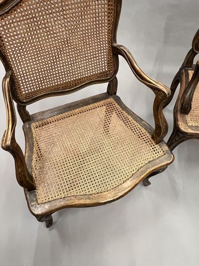 Pair of caned armchairs in molded and carved...