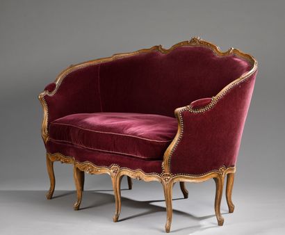 A molded and carved wood basket sofa, attributed...