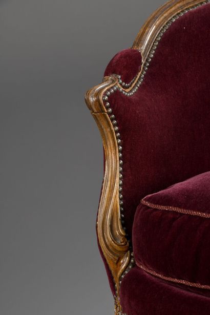 A molded and carved wood basket sofa, attributed...
