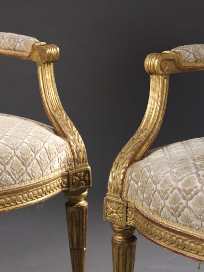 Pair of molded, carved and gilded wood armchairs...