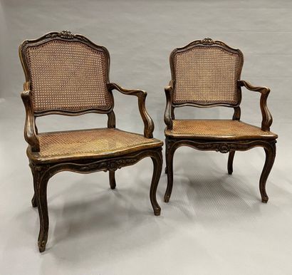 Pair of caned armchairs in molded and carved...