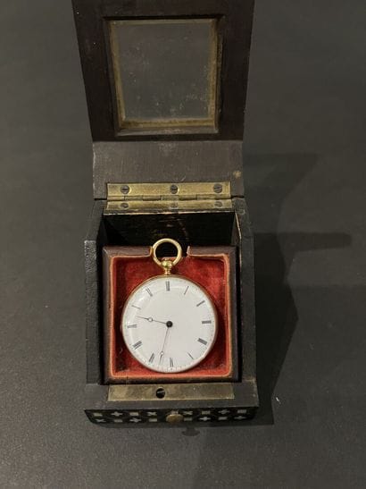 Gold watch circa 1850
On the back a coat...