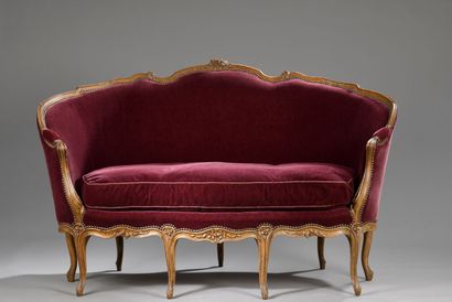 A molded and carved wood basket sofa, attributed...