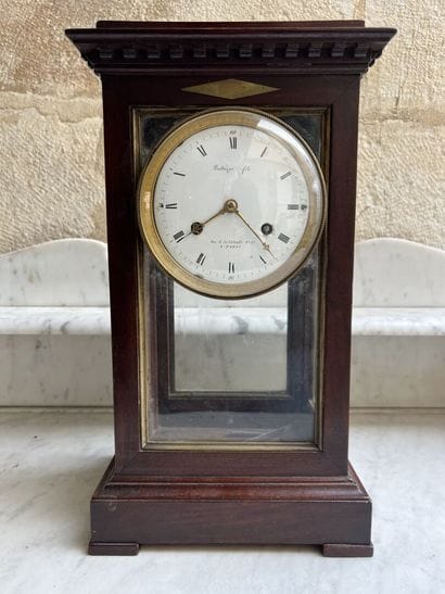 Cage clock in mahogany and mahogany veneer...