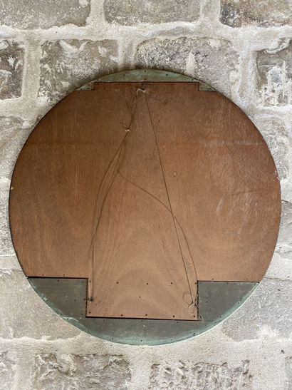 Circular glass decorated with two carved...
