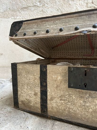 Doll trousseau contained in a travel trunk,...