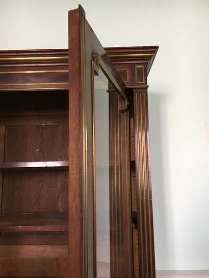 Mahogany and mahogany veneer showcase in...