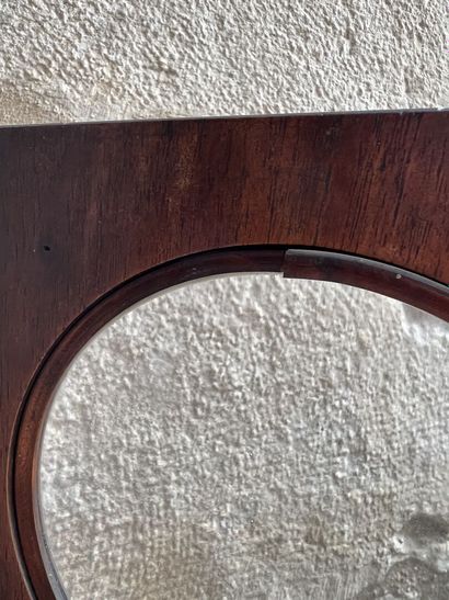 Magnifying glass on a natural wood pedestal,...