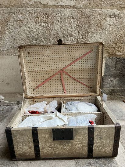 Doll trousseau contained in a travel trunk,...
