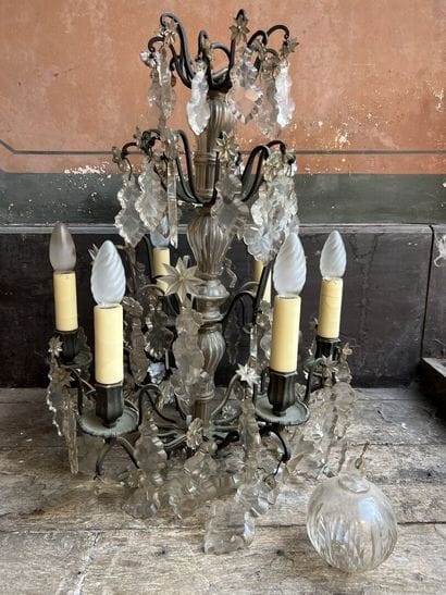 Chandelier with six arms of light beginning...