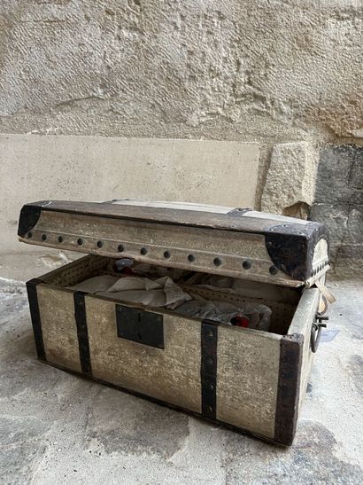 Doll trousseau contained in a travel trunk,...