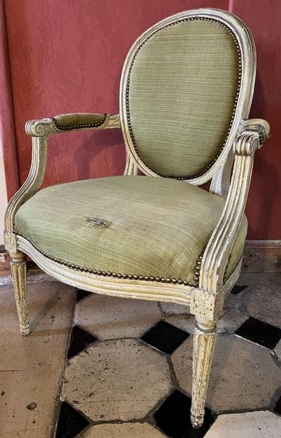 Louis XVI period cabriolet armchair in molded...