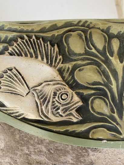 Circular glass decorated with two carved...