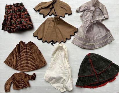 Doll trousseau contained in a travel trunk,...