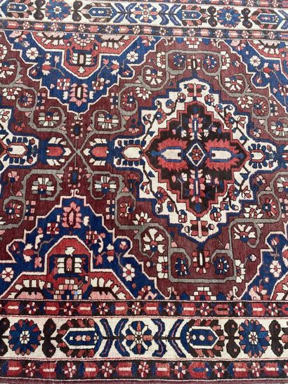 PERSIA 
Wool carpet decorated with flowers...