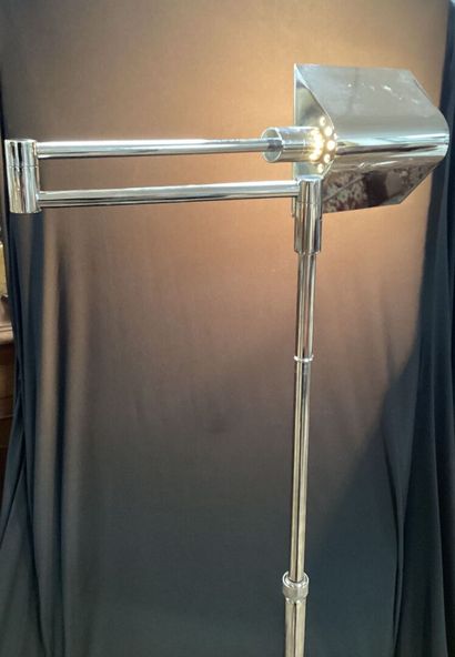 Chrome-plated steel reading lamp.
Height-adjustable...