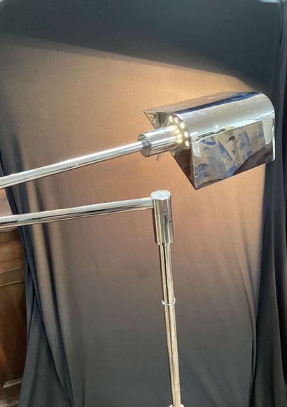 Chrome-plated steel reading lamp.
Height-adjustable...