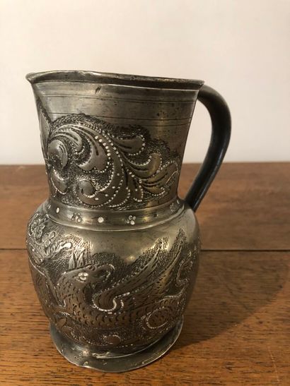 Pewter pitcher decorated with fleurs-de-lis...