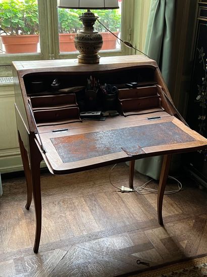 Louis XV period fruitwood sloping desk
It...