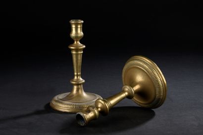 Pair of chased bronze candlesticks, formerly...