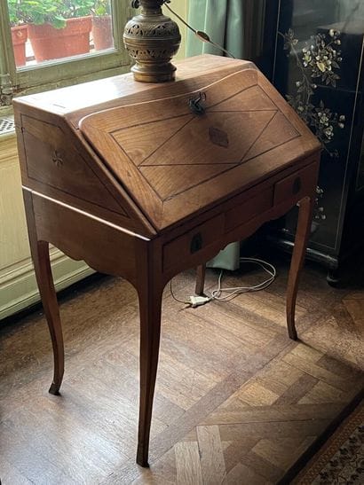 Louis XV period fruitwood sloping desk
It...