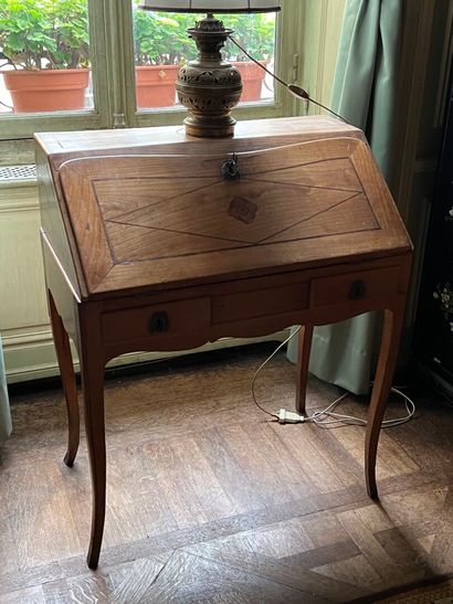 Louis XV period fruitwood sloping desk
It...
